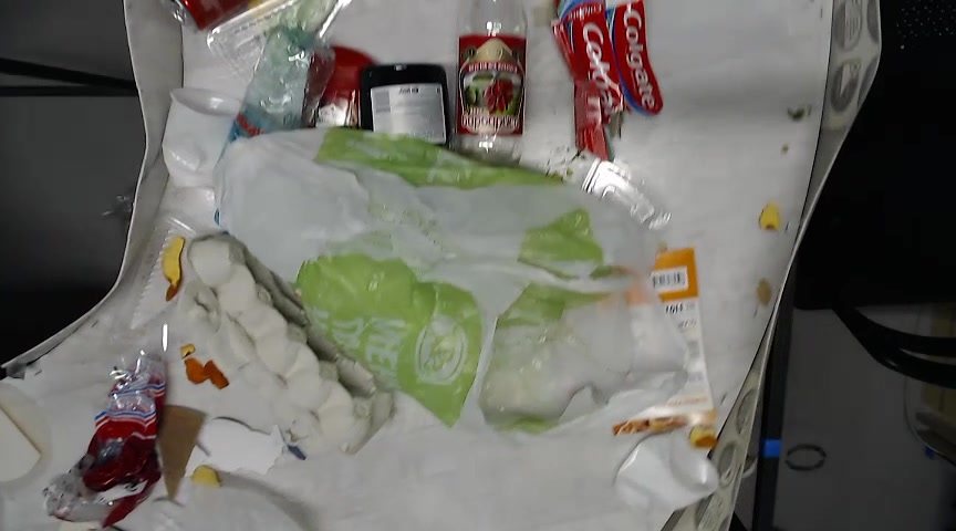 A typical labeled training frame: mixed waste on the table with detection boxes and class labels.
